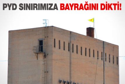 PYD, bayrağını sınıra dikti